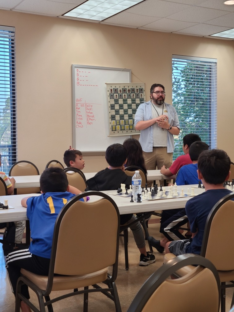 National Master Craig teaching a chess student