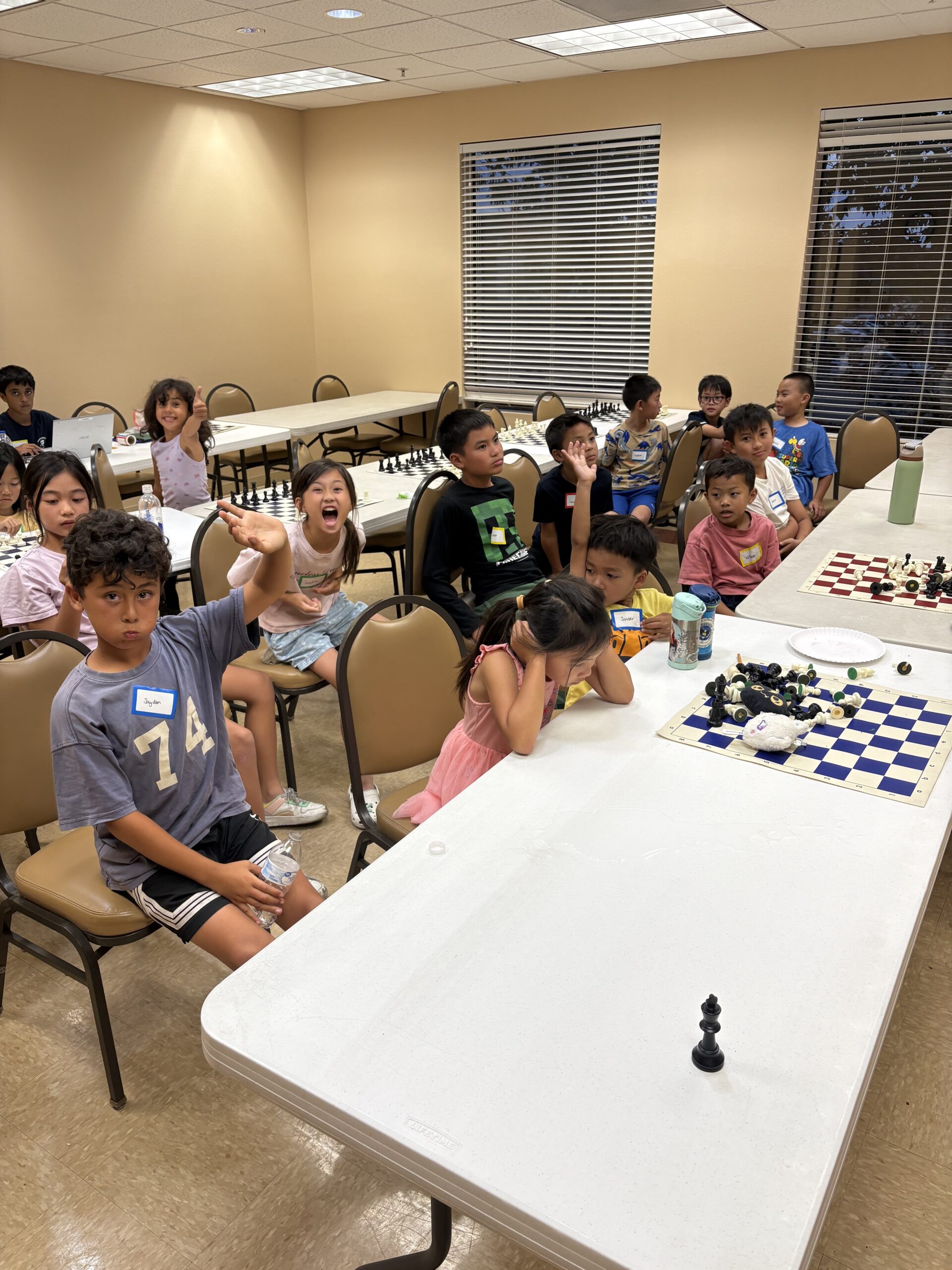 National Master Craig teaching a student chess in a focused setting